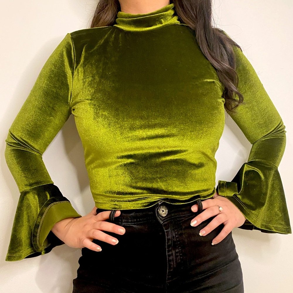 Green velvet turtleneck crop top.